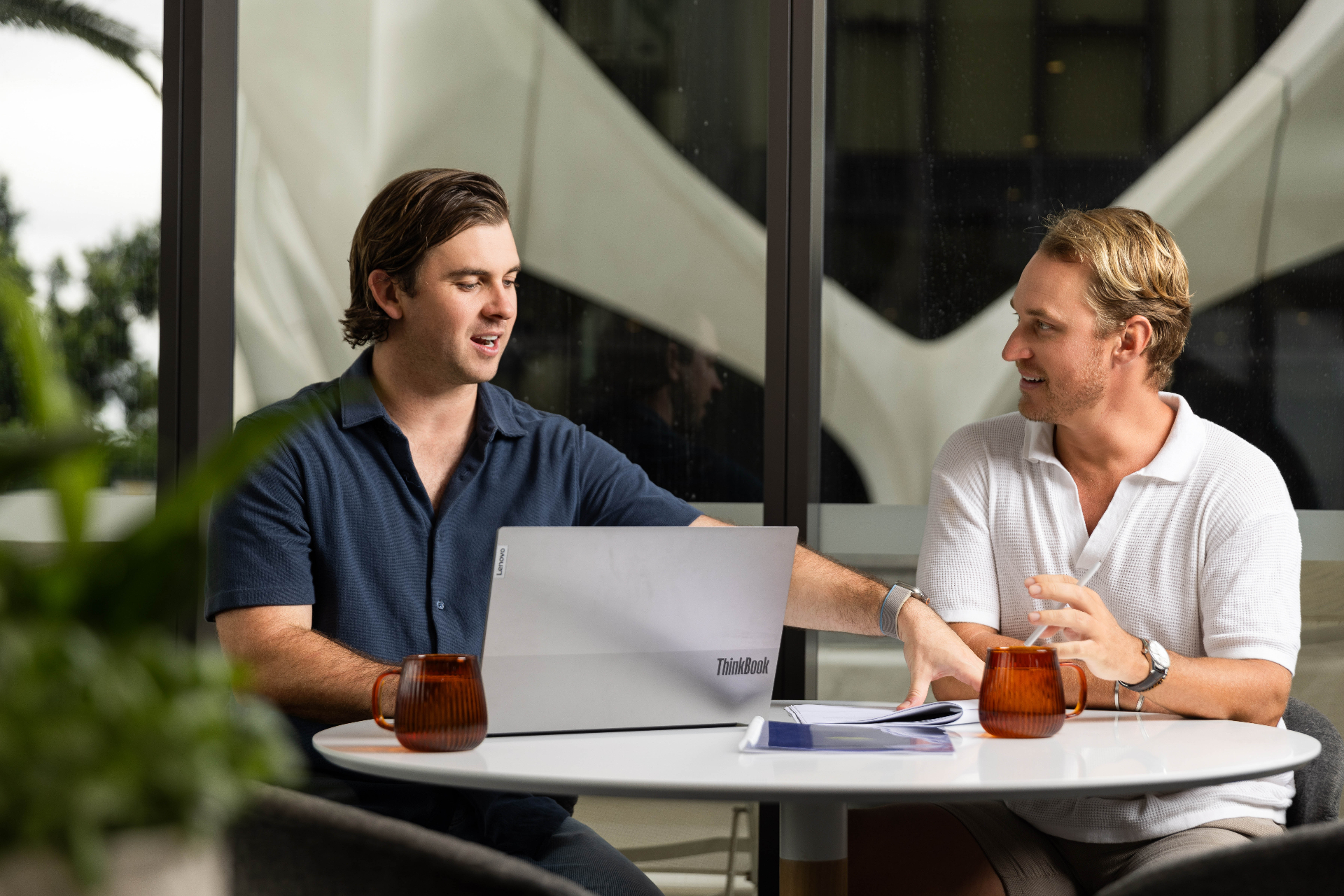 Two Wakefield Pacific team members welcoming a client at the Mermaid Beach office
